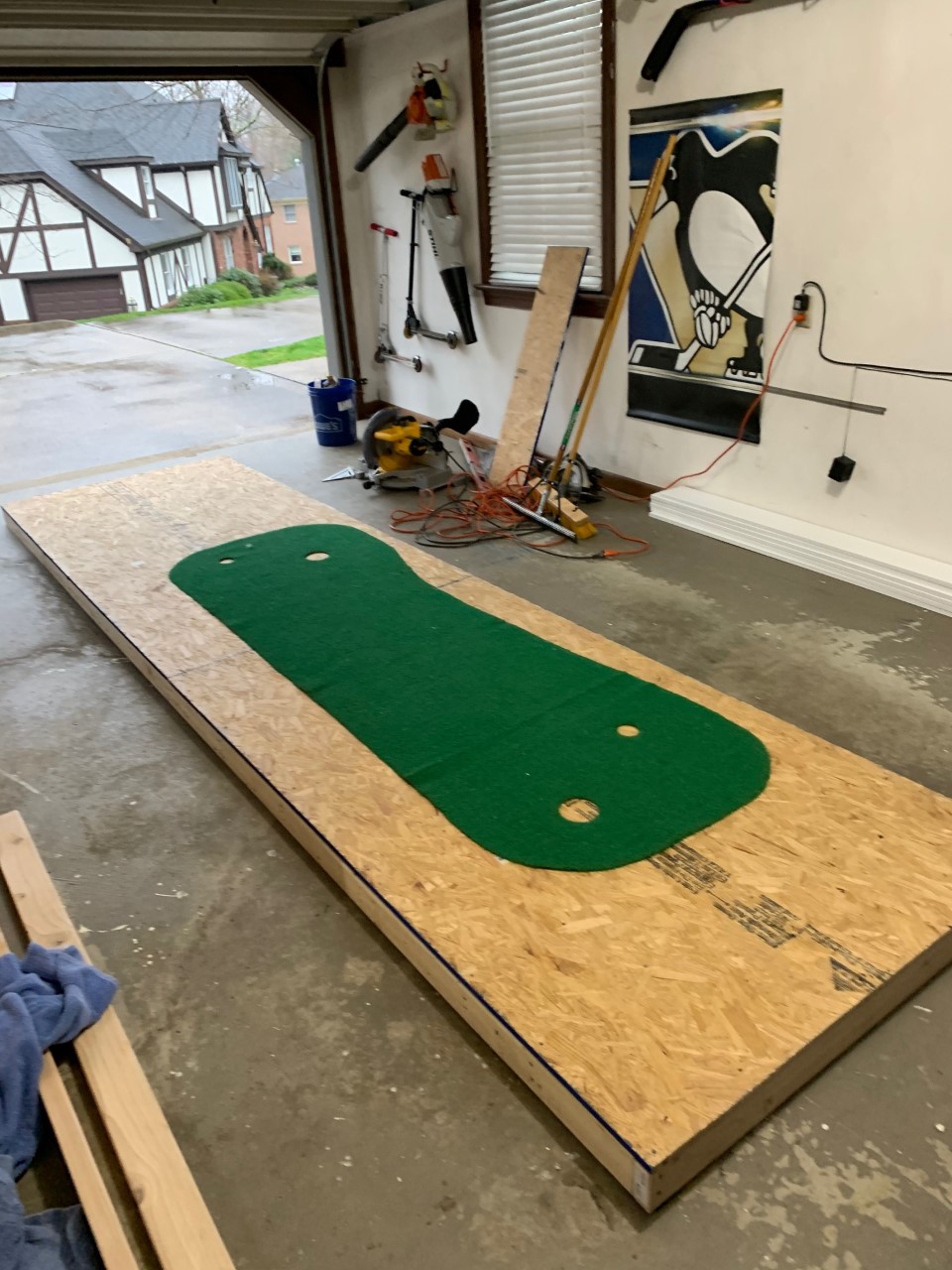 Particle board or Plywood works for DIY putting green. 1/2" or 3/4" is ideal.